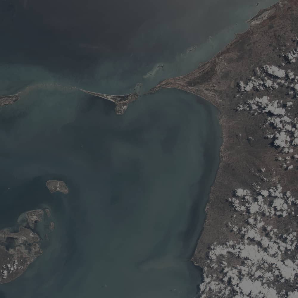Satellite view of a shallow coastal strait used as a survey reference panel.